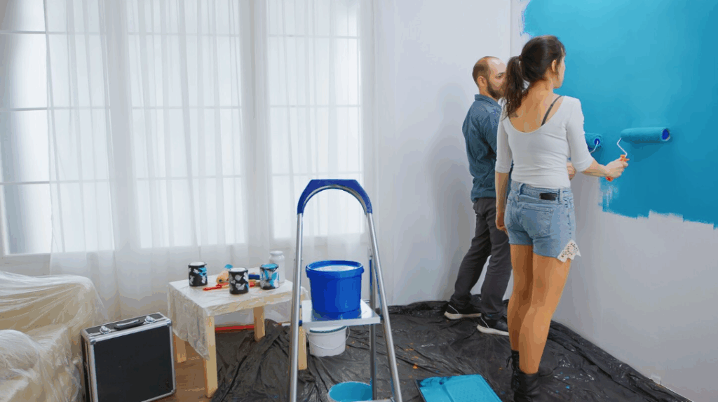 Fresh coat of blue paint applied to interior wall, showing a simple small home upgrade to raise value.